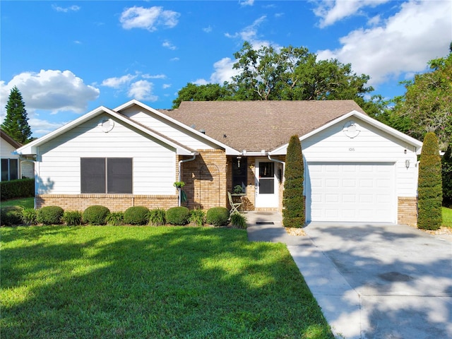 single story home featuring a front yard and a garage