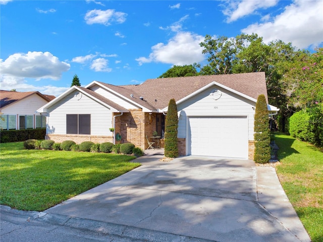 single story home featuring a garage and a front lawn