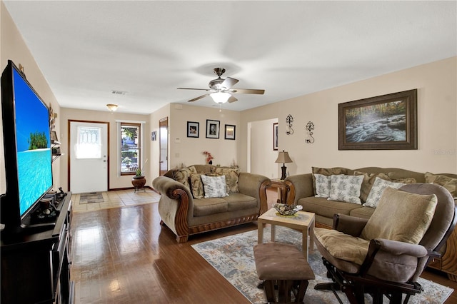 living room with ceiling fan and hardwood / wood-style floors