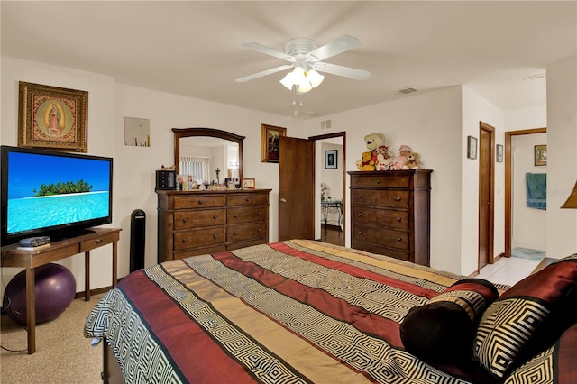 bedroom with ceiling fan and light carpet