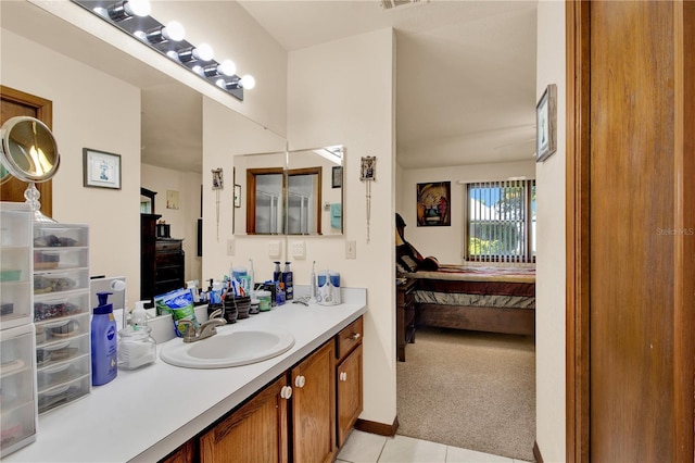 bathroom with tile patterned flooring and vanity