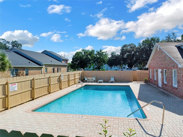 view of pool featuring a patio