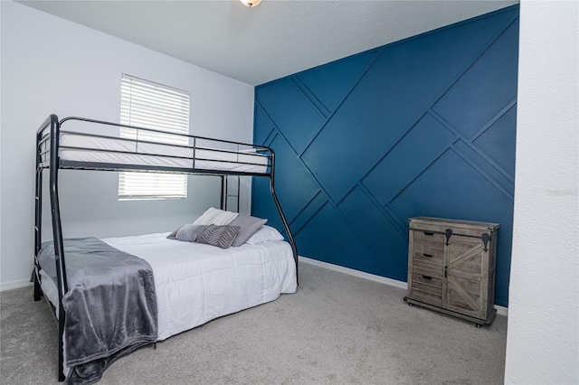 bedroom with carpet and a textured ceiling