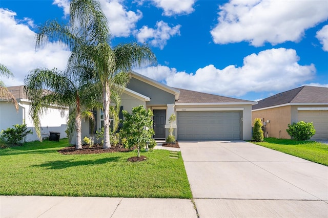 ranch-style home featuring a front lawn and a garage