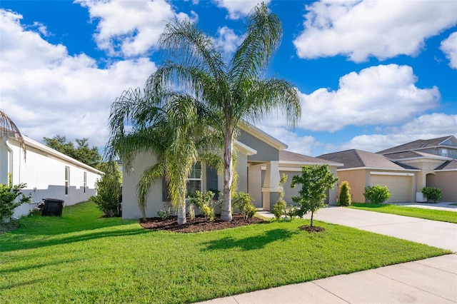 view of front of house featuring a front lawn and a garage