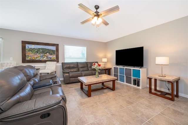 living room with ceiling fan and light tile patterned flooring