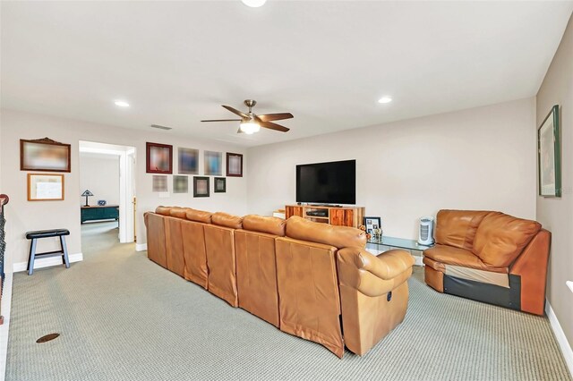 living room featuring light carpet and ceiling fan