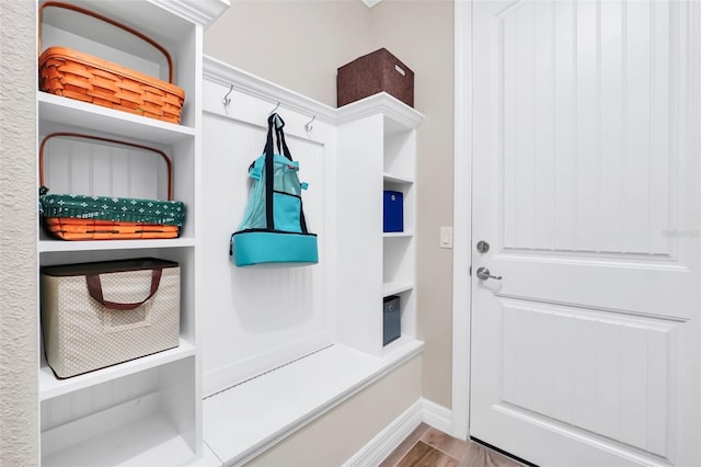 mudroom with light hardwood / wood-style floors