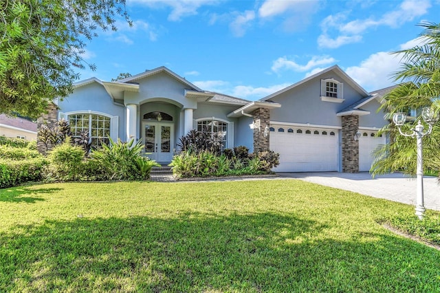 2228 Valrico Forest Dr, Valrico, FL 33594 - view of front facade featuring a front lawn, french doors, and a garage