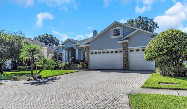 2228 Valrico Forest Dr, Valrico, FL 33594 - view of property with a garage and a front lawn