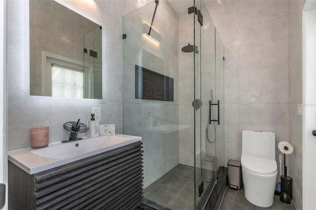 2228 Valrico Forest Dr, Valrico, FL 33594 - bathroom featuring vanity, toilet, an enclosed shower, tile walls, and tile patterned flooring