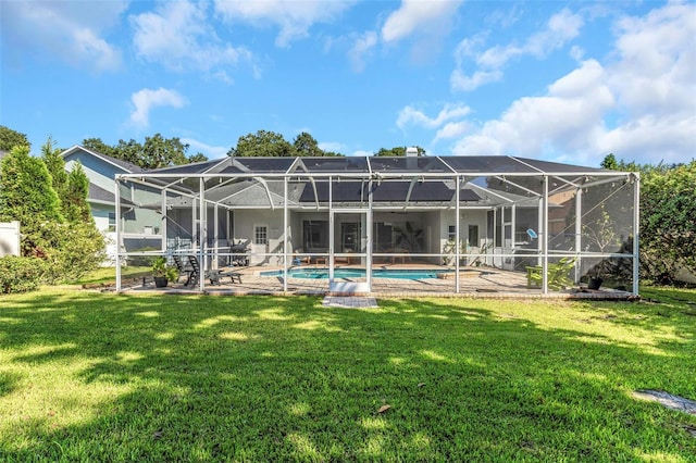 2228 Valrico Forest Dr, Valrico, FL 33594 - rear view of house featuring glass enclosure, a lawn, and a patio