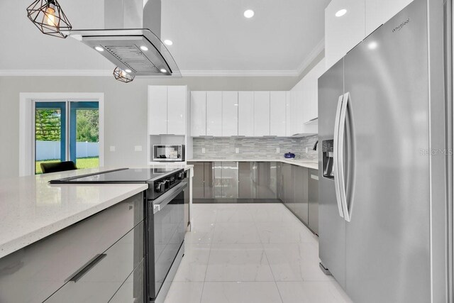 kitchen featuring hanging light fixtures, backsplash, white cabinetry, stainless steel appliances, and crown molding