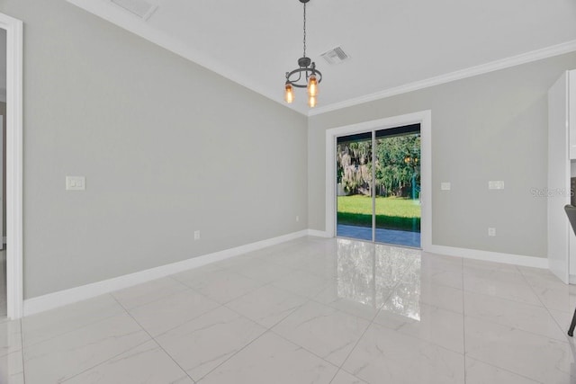 spare room featuring crown molding and a chandelier