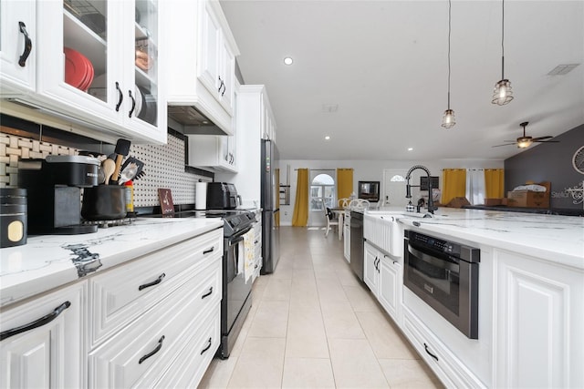 kitchen with white cabinetry, backsplash, black appliances, ceiling fan, and decorative light fixtures