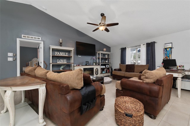 tiled living room featuring ceiling fan and lofted ceiling