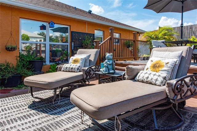 view of patio / terrace with a wooden deck and an outdoor hangout area