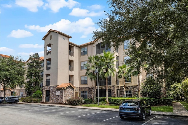 1301 Tuscan Ter Unit 9403, Davenport, FL 33896 - view of building exterior with uncovered parking