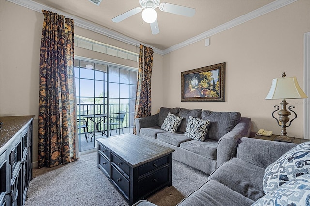 living room featuring ceiling fan, carpet flooring, and crown molding