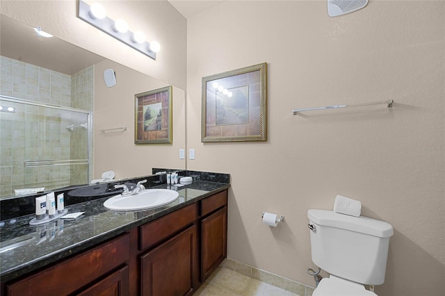 bathroom with walk in shower, tile patterned flooring, vanity, and toilet