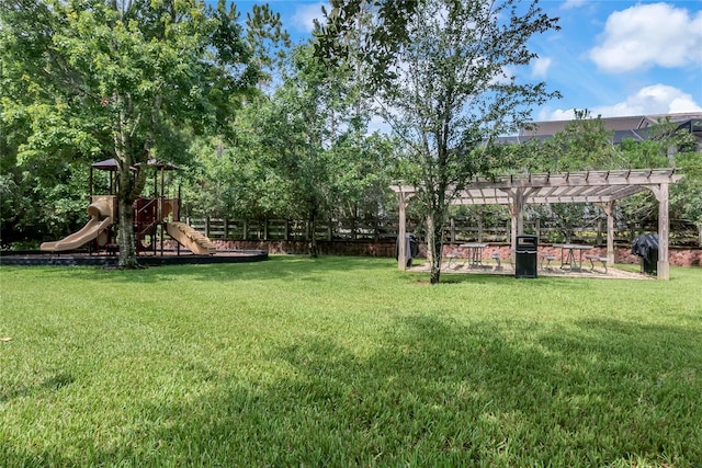 view of yard with a playground and a pergola