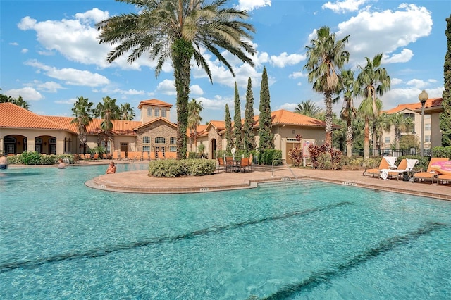 view of swimming pool featuring a patio area