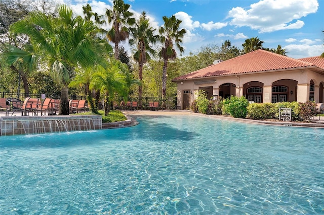 view of pool with pool water feature