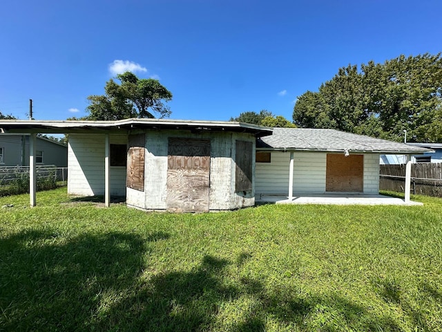 back of house featuring a patio area, a yard, and fence