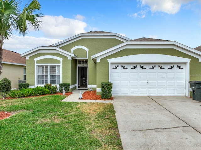 ranch-style home featuring a garage and a front yard