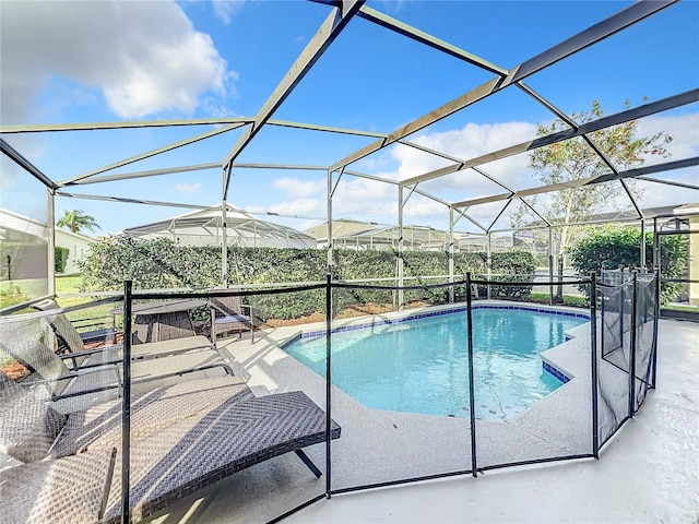 view of pool with a lanai and a patio area