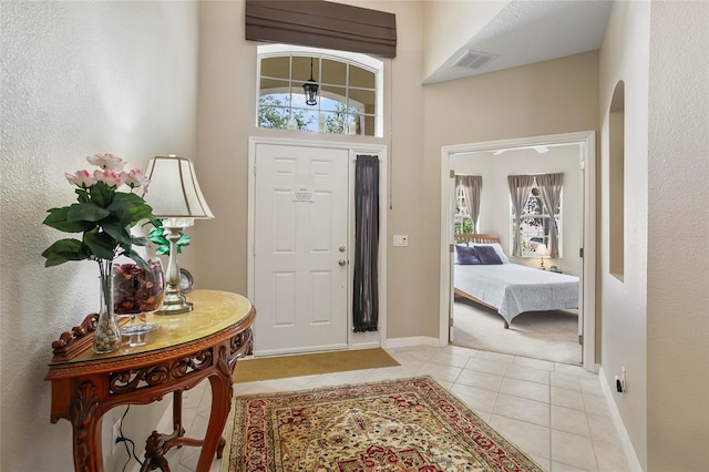 foyer with light tile patterned flooring