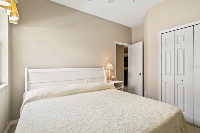 bedroom featuring ceiling fan and a closet