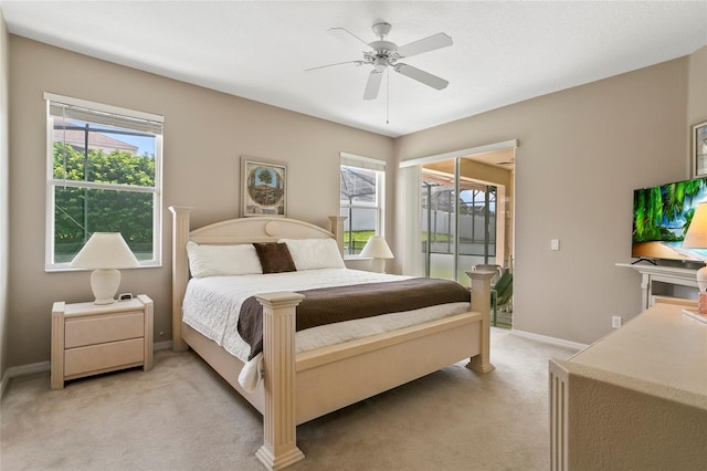 bedroom with ceiling fan, light colored carpet, and access to outside