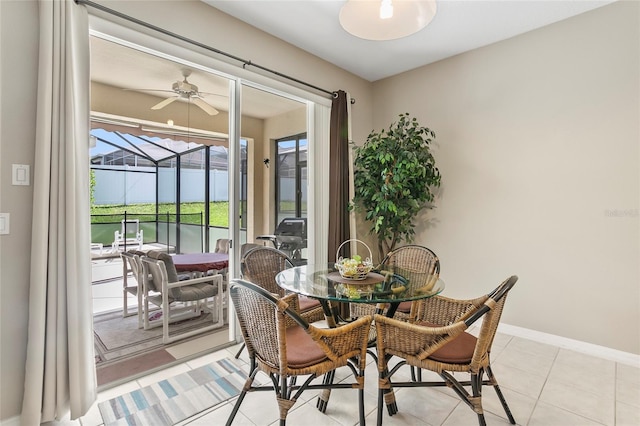 dining room with light tile patterned floors and ceiling fan