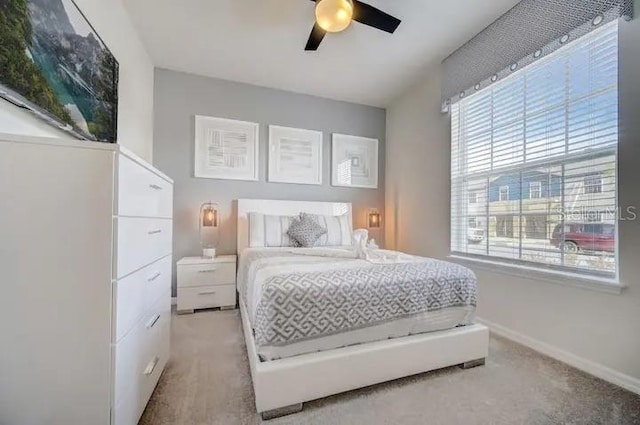 bedroom featuring ceiling fan and carpet floors