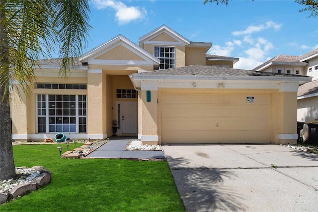 view of front of house with a garage and a front yard