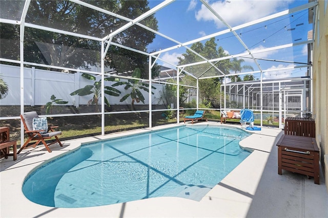 view of pool featuring a patio and a lanai