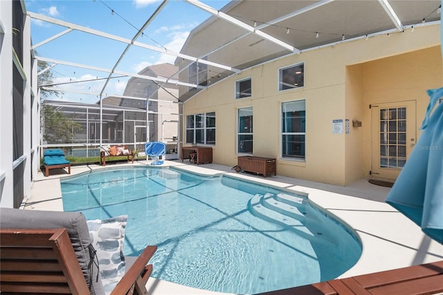 view of pool featuring a patio and a lanai