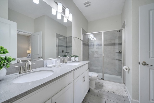 bathroom with tile patterned floors, an enclosed shower, toilet, and vanity