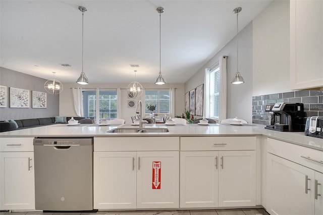 kitchen with pendant lighting, dishwasher, white cabinets, and sink