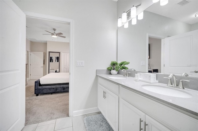 bathroom featuring tile patterned floors, vanity, and ceiling fan