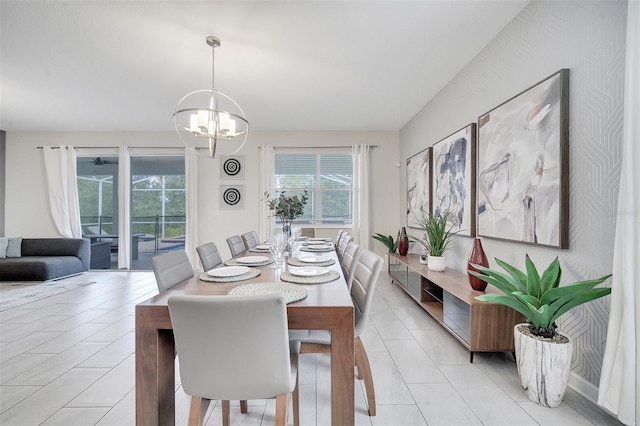 tiled dining room with plenty of natural light and a notable chandelier