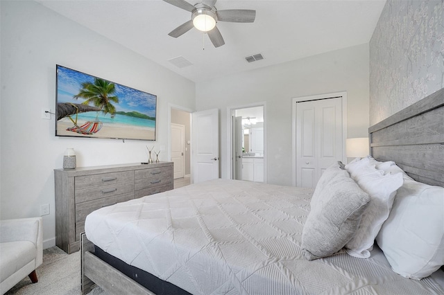 bedroom with ceiling fan, connected bathroom, and carpet