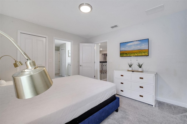 carpeted bedroom with a closet