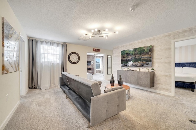 carpeted living room featuring a textured ceiling