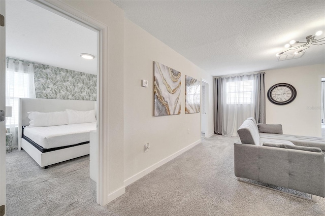 carpeted living room with a textured ceiling