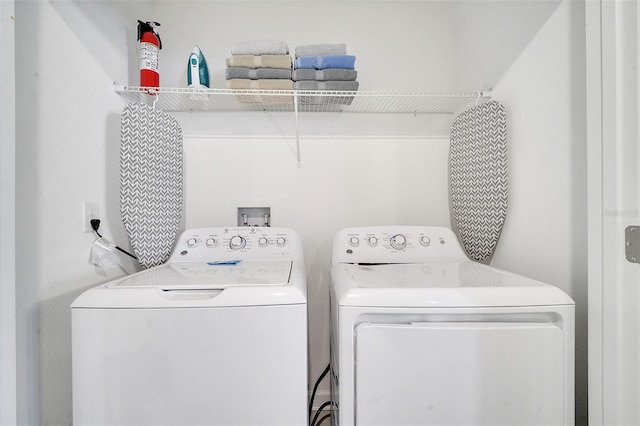 washroom with washer and clothes dryer