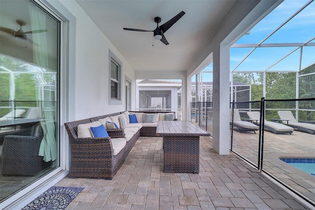 sunroom / solarium with ceiling fan and a healthy amount of sunlight