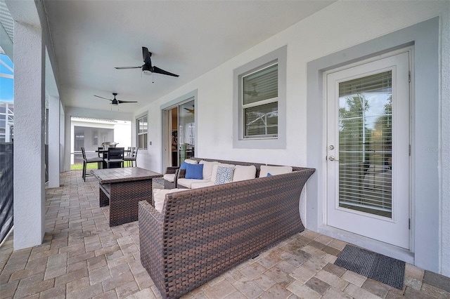 view of patio / terrace featuring ceiling fan and an outdoor living space