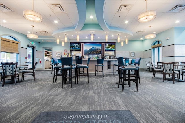 dining area with dark colored carpet